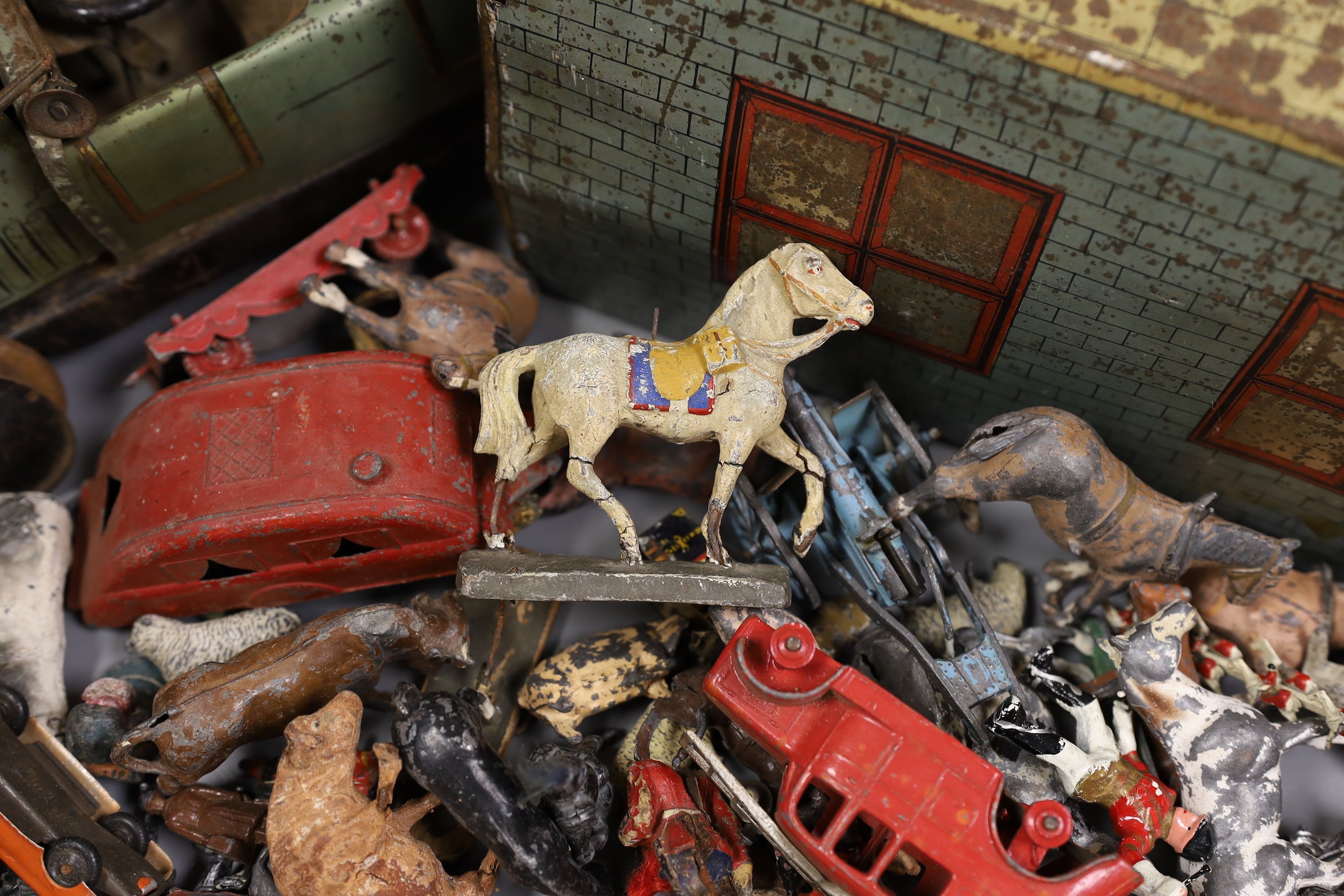 Brenco lithographed tinplate open tourer, and garage, and assorted hollow-cast toys, Elastolic, Dinky Toys, etc.